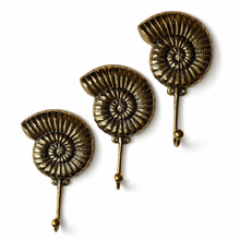 Load image into Gallery viewer, Brass Ammonite Fossil Wall Hook β Coastal Shell Hook, Beach House Bathroom Towel Hanger