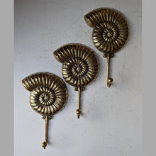 Load image into Gallery viewer, Brass Ammonite Fossil Wall Hook β Coastal Shell Hook, Beach House Bathroom Towel Hanger