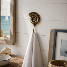 Load image into Gallery viewer, Brass Ammonite Fossil Wall Hook β Coastal Shell Hook, Beach House Bathroom Towel Hanger